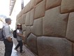 Amazing Inca stonework in central Cuzco. The Spanish demolished the Inca temples and palaces but kept the foundations and outer walls. With our lovely guide, Monica.